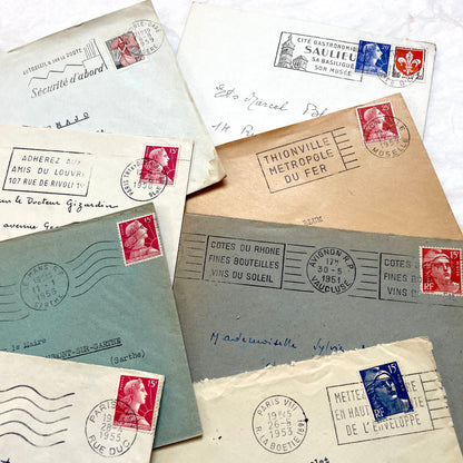 Lot of 20 French envelopes from the 1950s, featuring various postal stamps, handwritten addresses, and distinct postmarks.