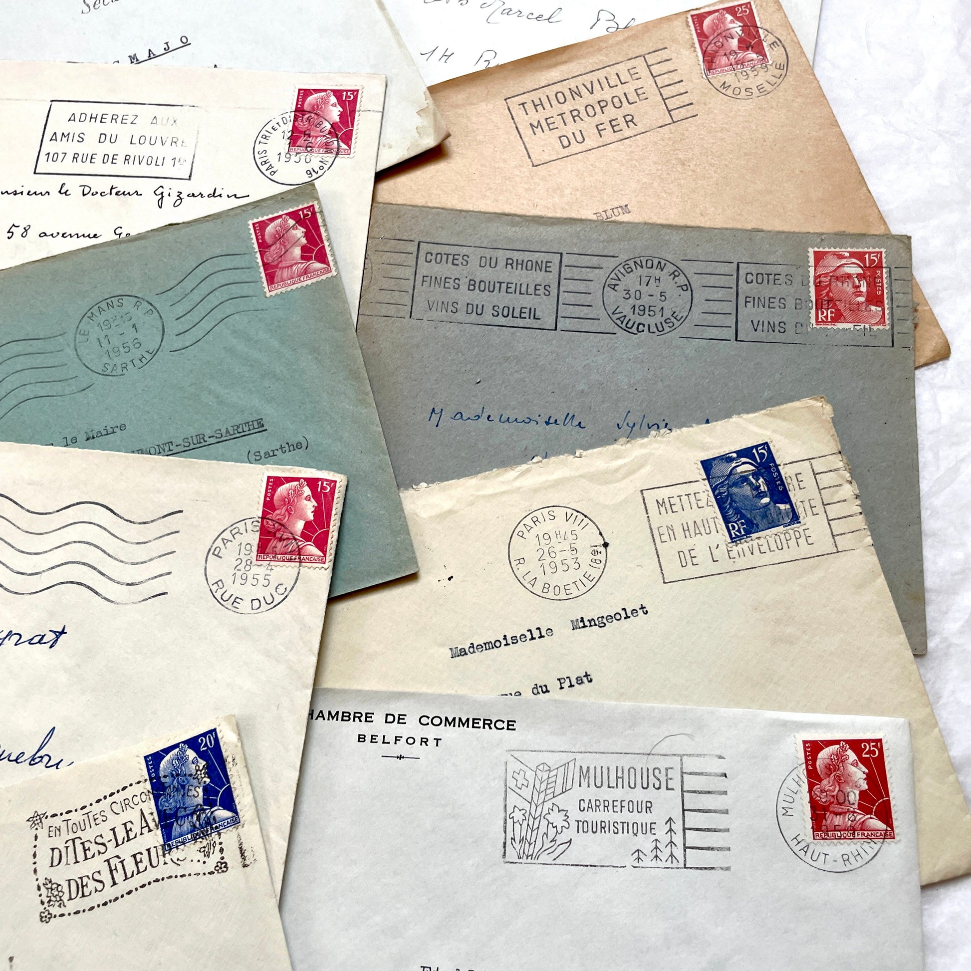 Lot of 20 French envelopes from the 1950s, featuring various postal stamps, handwritten addresses, and distinct postmarks.