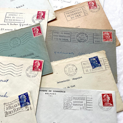 Lot of 20 French envelopes from the 1950s, featuring various postal stamps, handwritten addresses, and distinct postmarks.
