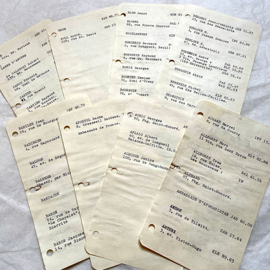 Lot of 1950s French Rolodex cards with typed Parisian names, addresses, and old phone numbers.