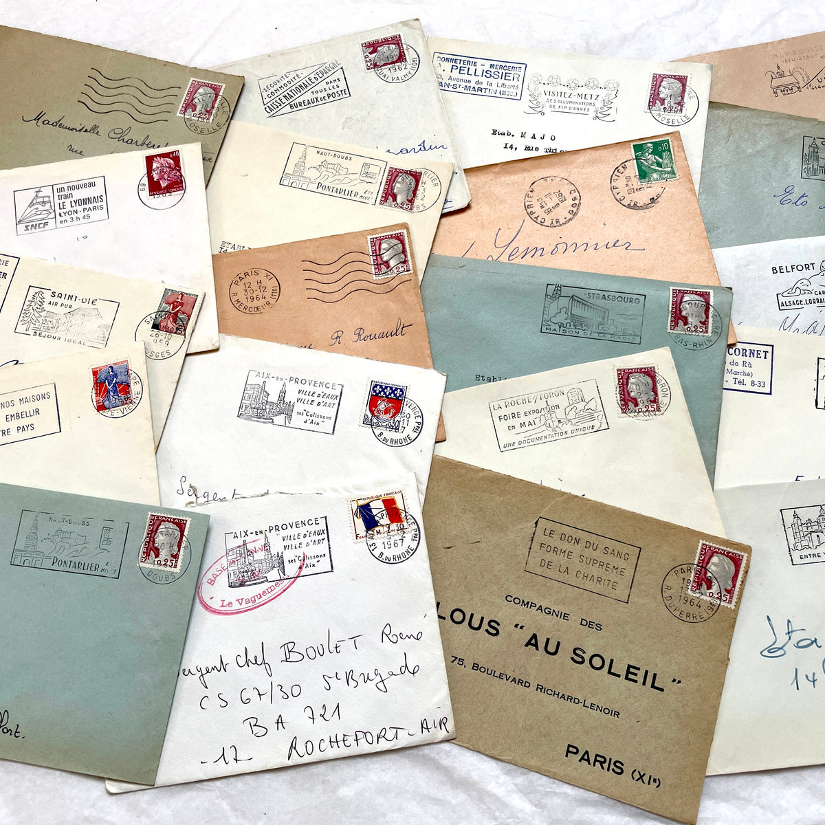 Lot of 20 vintage French envelopes from the 1960s, showcasing diverse stamps and postmarks from various French cities.