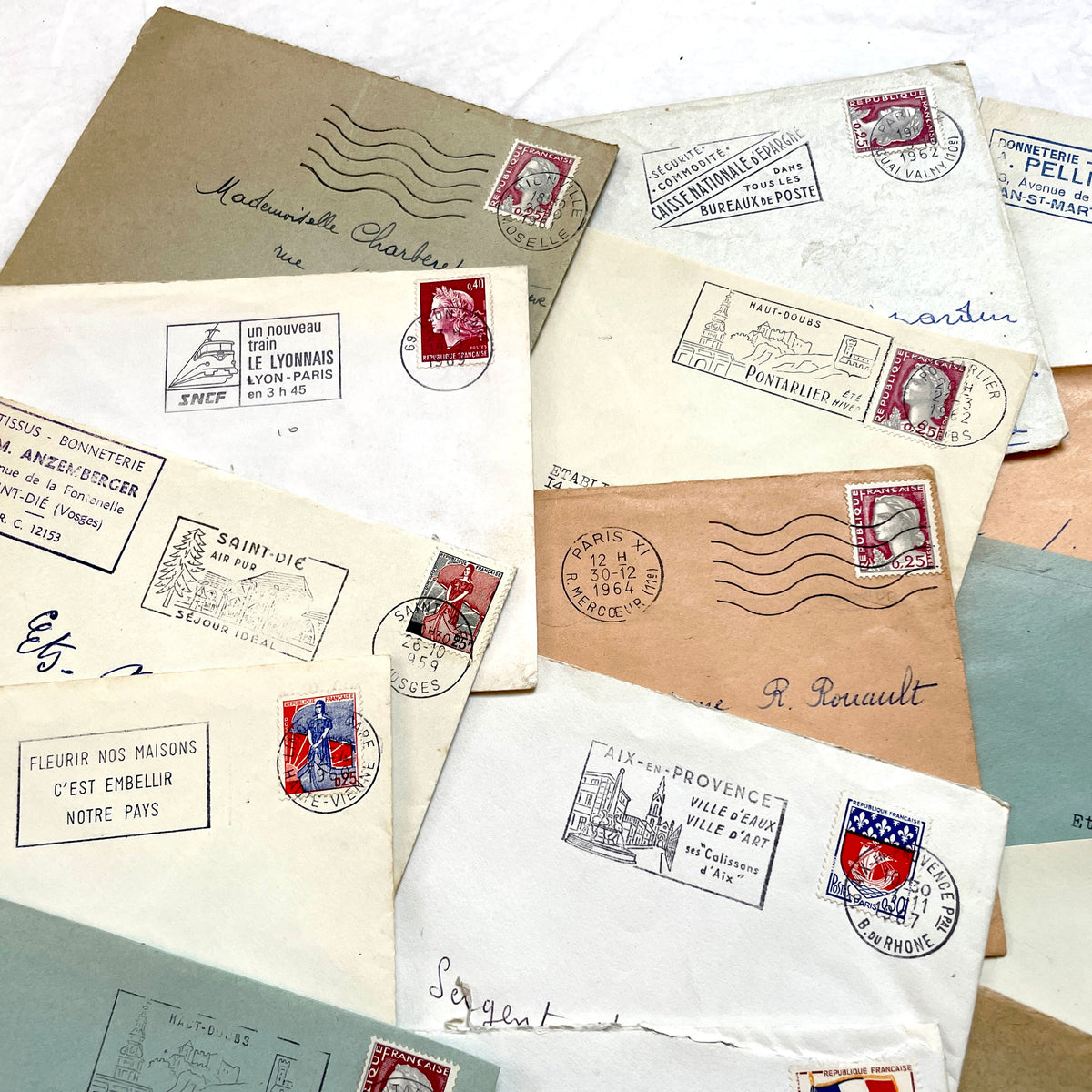 Lot of 20 vintage French envelopes from the 1960s, showcasing diverse stamps and postmarks from various French cities.