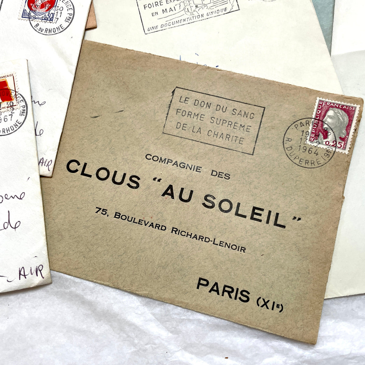 Lot of 20 vintage French envelopes from the 1960s, showcasing diverse stamps and postmarks from various French cities.
