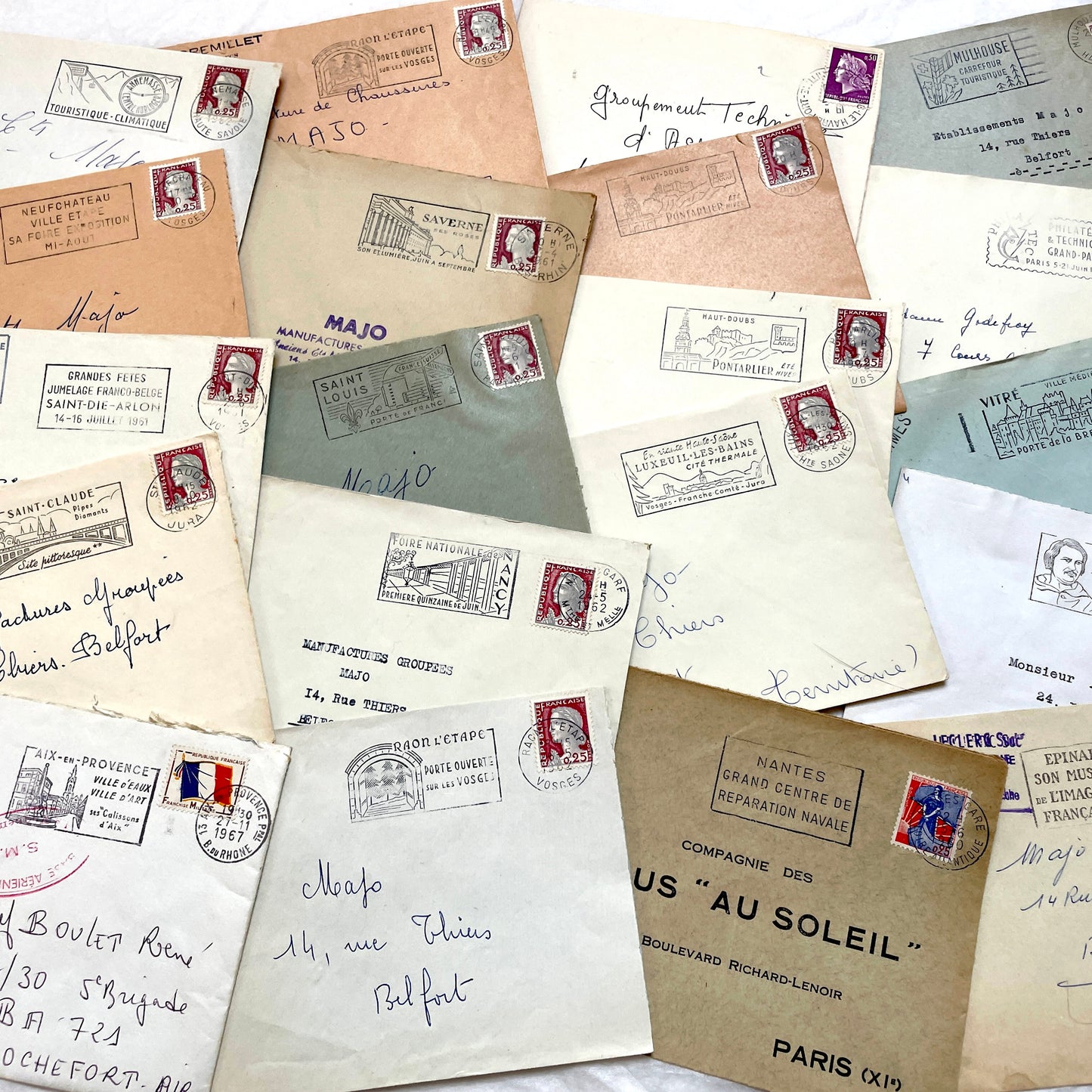 A collection of 20 French envelopes from the 1960s, featuring various postage stamps and unique regional postmarks.
