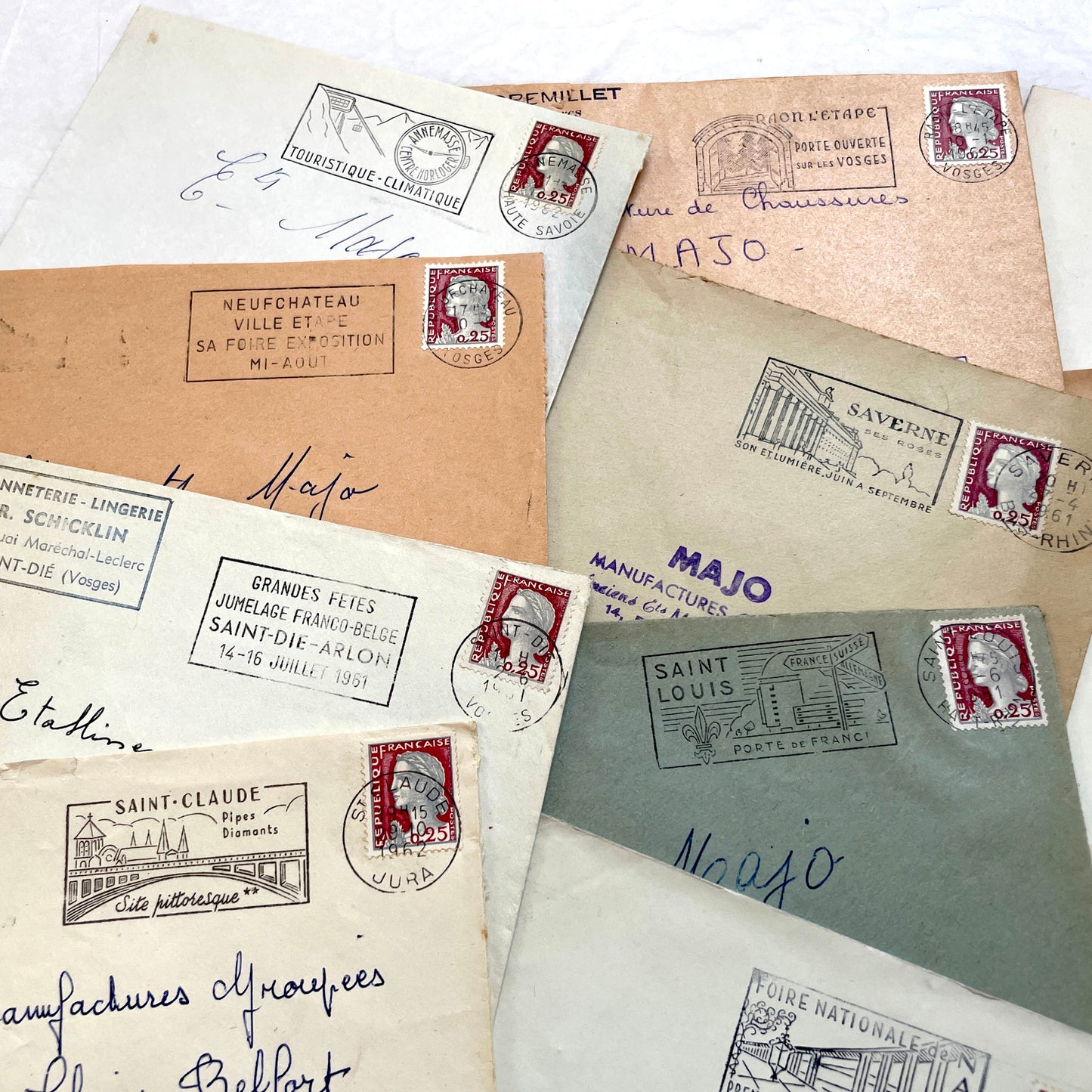 A collection of 20 French envelopes from the 1960s, featuring various postage stamps and unique regional postmarks.
