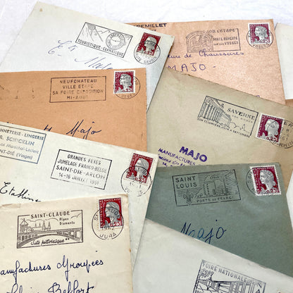 A collection of 20 French envelopes from the 1960s, featuring various postage stamps and unique regional postmarks.