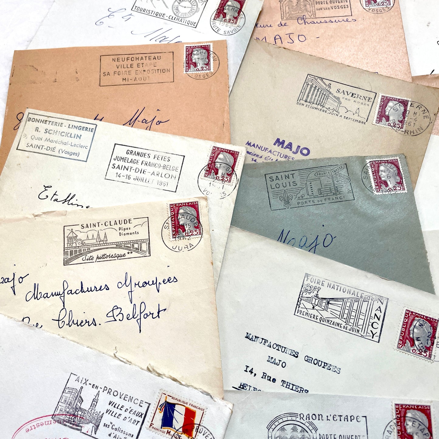 A collection of 20 French envelopes from the 1960s, featuring various postage stamps and unique regional postmarks.