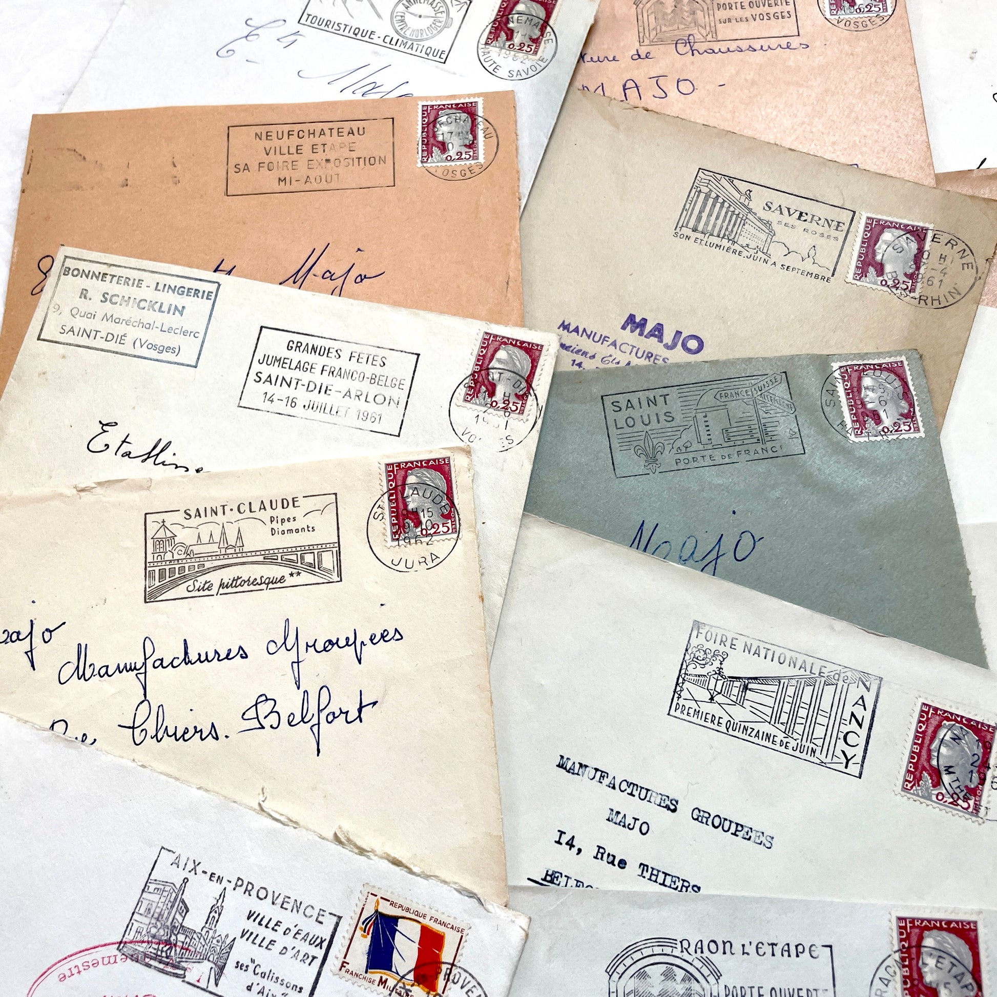 A collection of 20 French envelopes from the 1960s, featuring various postage stamps and unique regional postmarks.