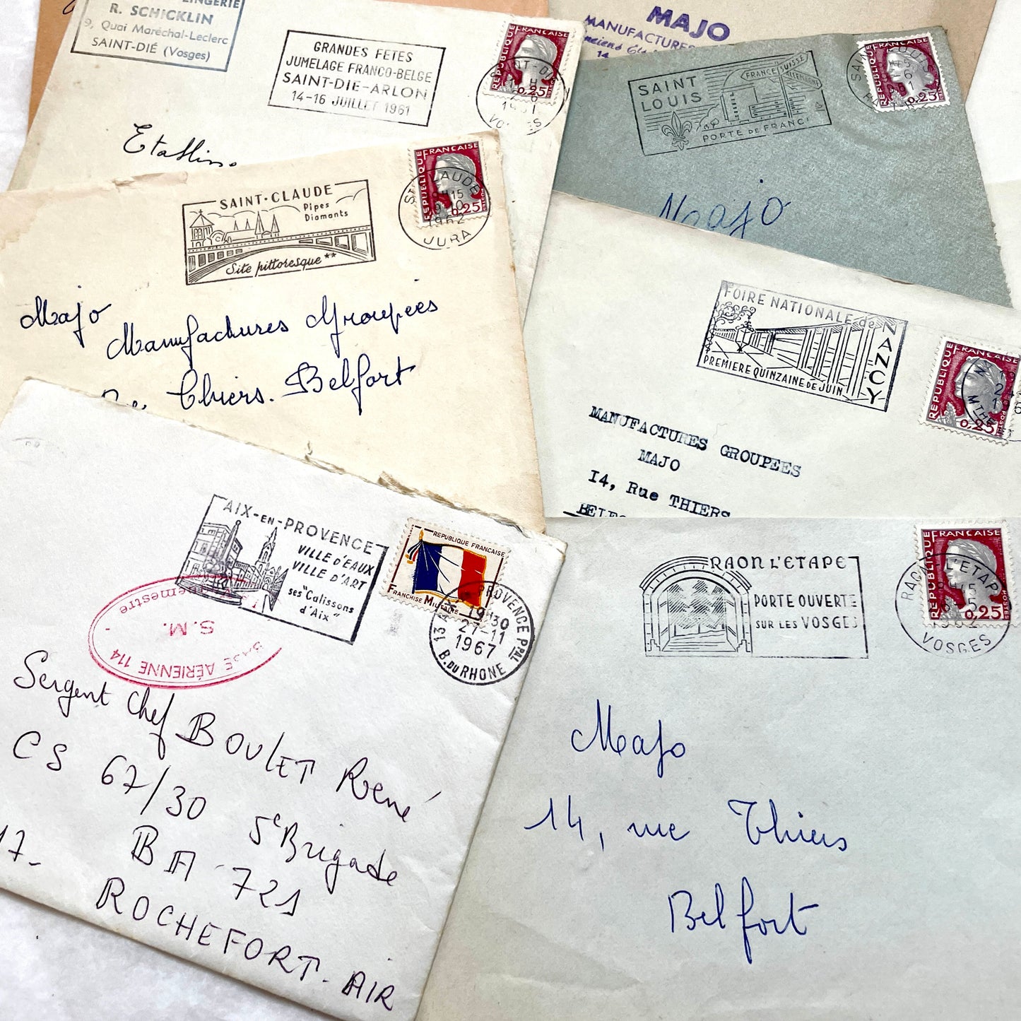 A collection of 20 French envelopes from the 1960s, featuring various postage stamps and unique regional postmarks.