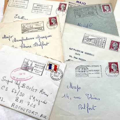 A collection of 20 French envelopes from the 1960s, featuring various postage stamps and unique regional postmarks.