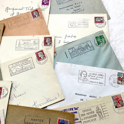 A collection of 20 French envelopes from the 1960s, featuring various postage stamps and unique regional postmarks.