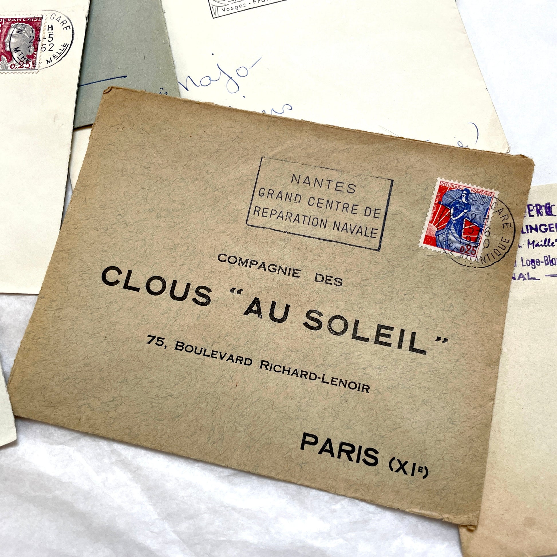 A collection of 20 French envelopes from the 1960s, featuring various postage stamps and unique regional postmarks.