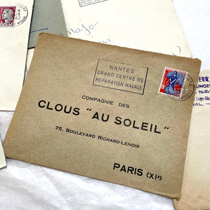A collection of 20 French envelopes from the 1960s, featuring various postage stamps and unique regional postmarks.
