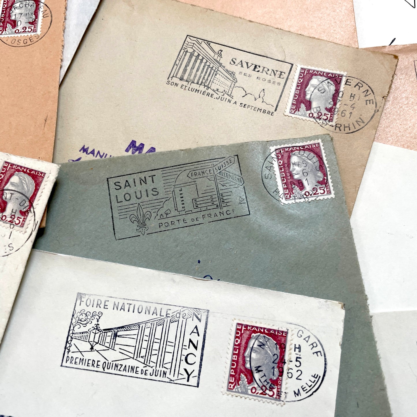 A collection of 20 French envelopes from the 1960s, featuring various postage stamps and unique regional postmarks.