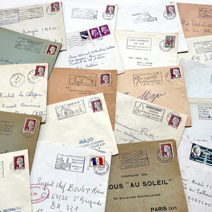 Lot of 20 1960s French envelopes with original stamps and diverse postmarks, showing various city letterheads.