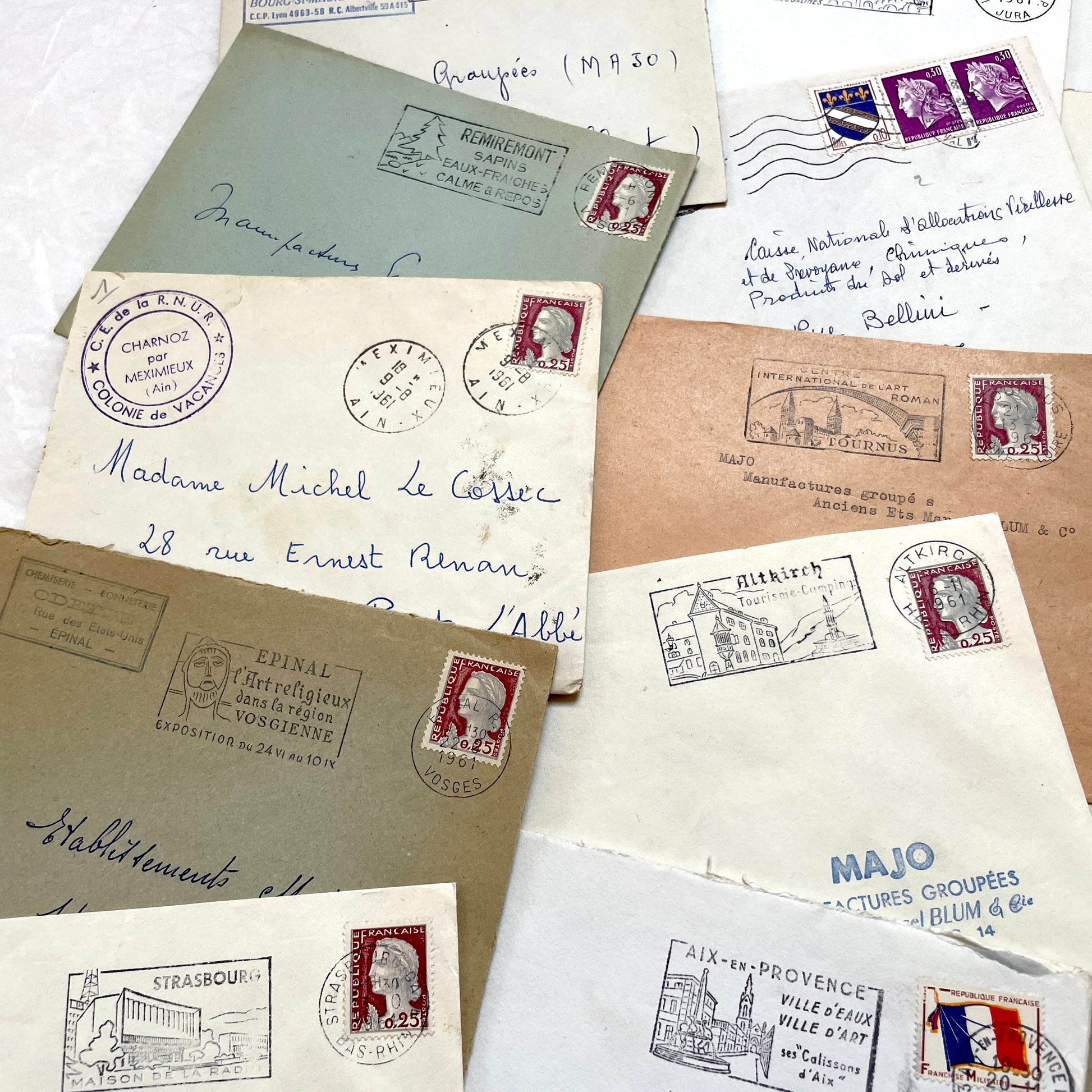 Lot of 20 1960s French envelopes with original stamps and diverse postmarks, showing various city letterheads.