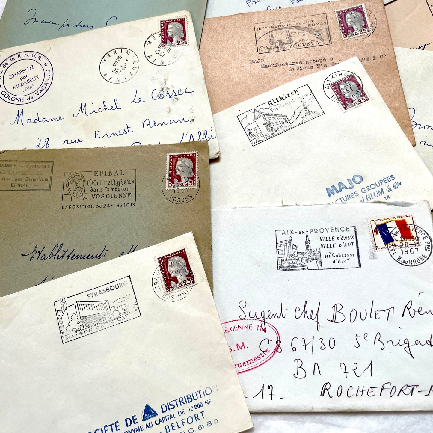Lot of 20 1960s French envelopes with original stamps and diverse postmarks, showing various city letterheads.