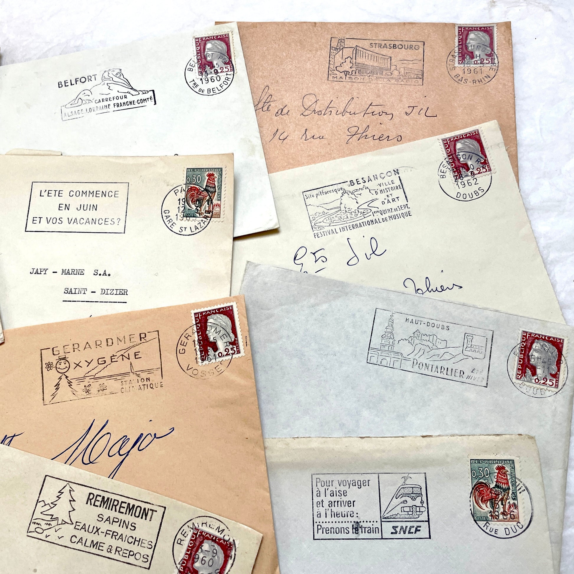 Lot of 20 1960s French envelopes with original stamps and diverse postmarks, showing various city letterheads.