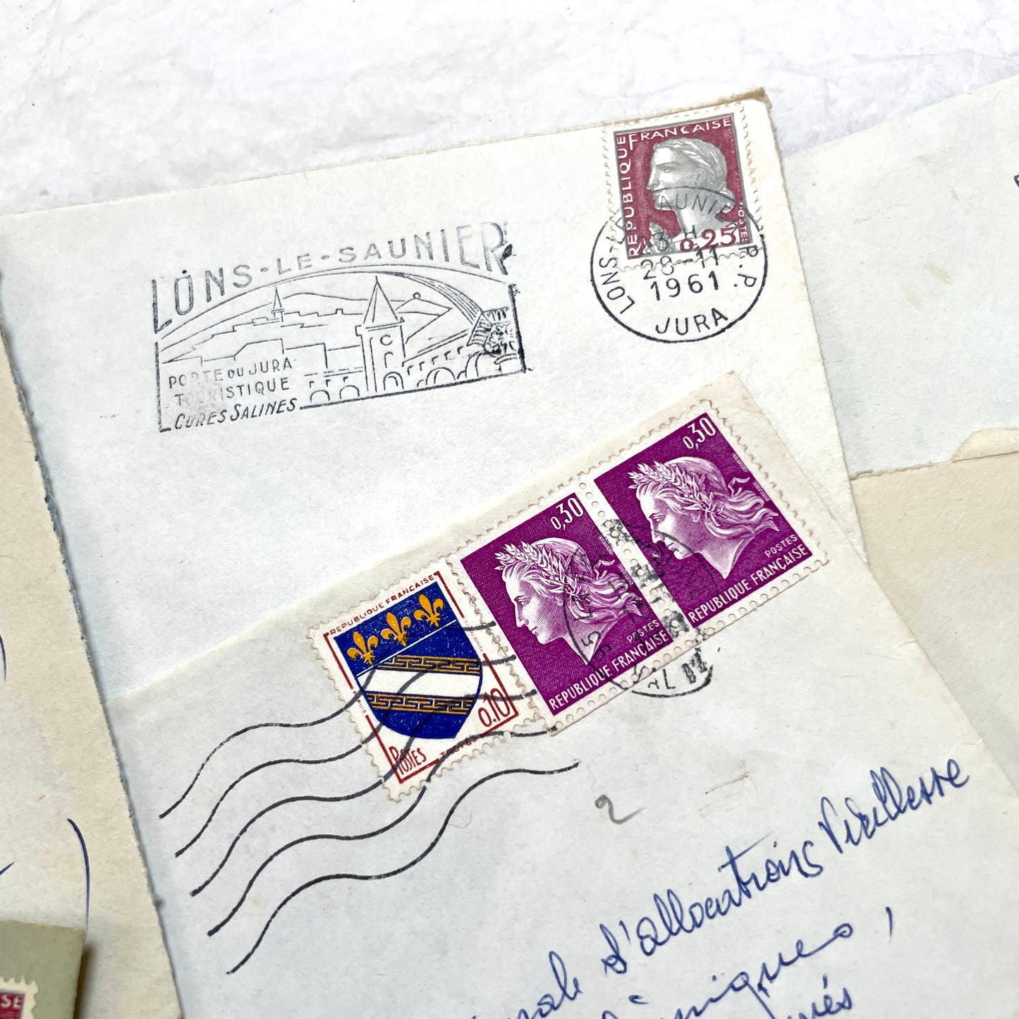 Lot of 20 1960s French envelopes with original stamps and diverse postmarks, showing various city letterheads.