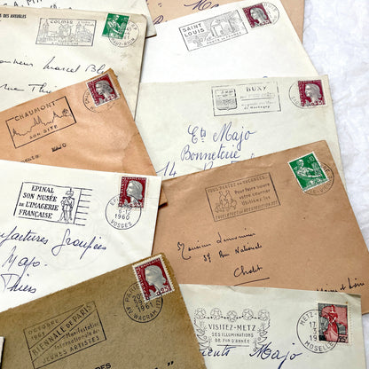 A batch of 20 vintage 1960s French envelopes featuring assorted postmarks, handwritten addresses, and Republic Française stam