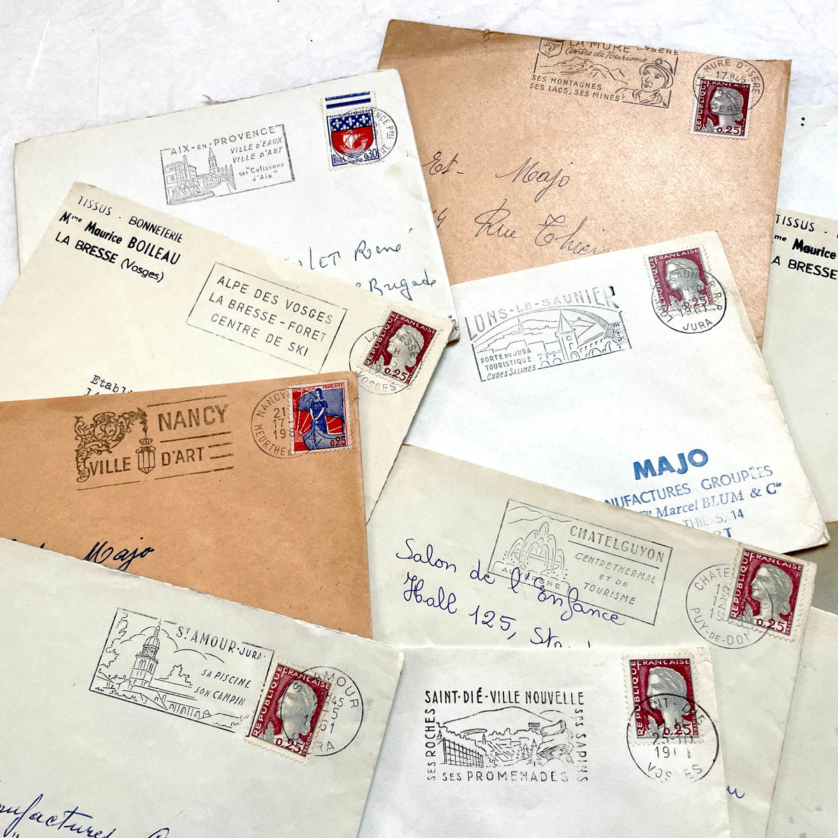 Vintage 1960s French envelopes lot featuring various stamps, postmarks, and handwritten addresses from across France.