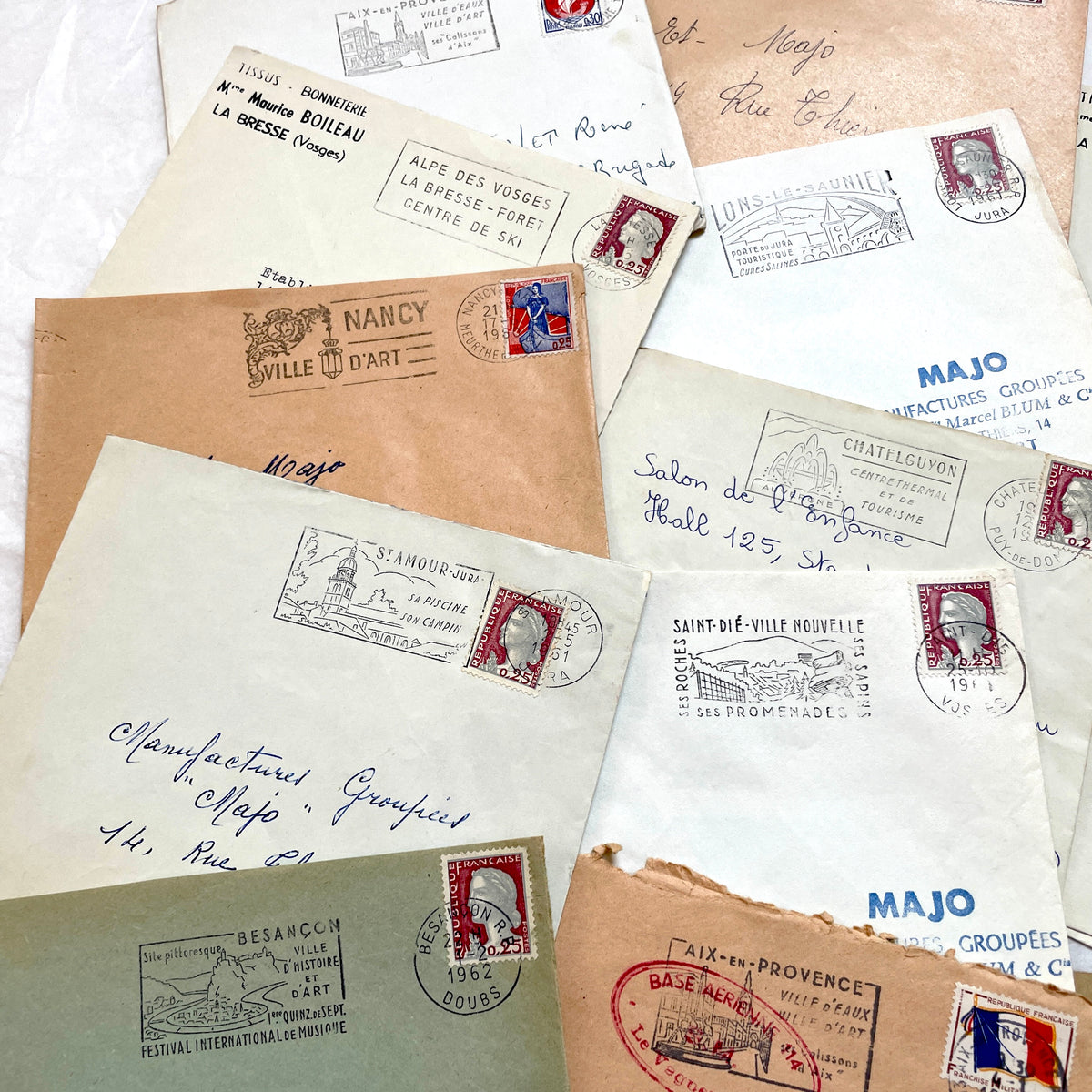 Vintage 1960s French envelopes lot featuring various stamps, postmarks, and handwritten addresses from across France.