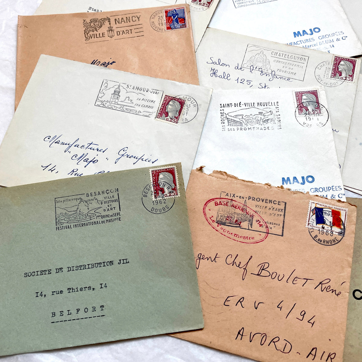 Vintage 1960s French envelopes lot featuring various stamps, postmarks, and handwritten addresses from across France.