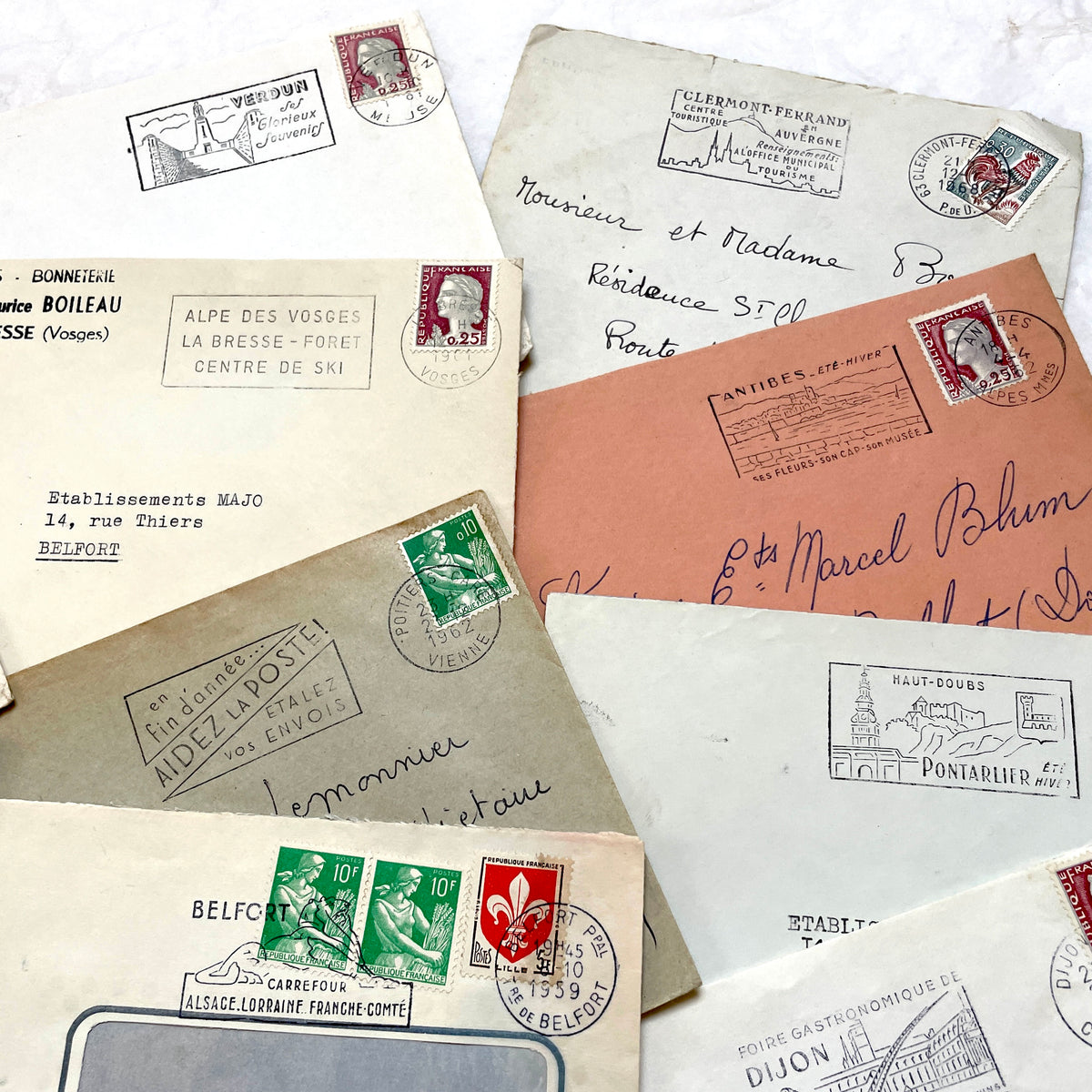 Vintage 1960s French envelopes lot featuring various stamps, postmarks, and handwritten addresses from across France.