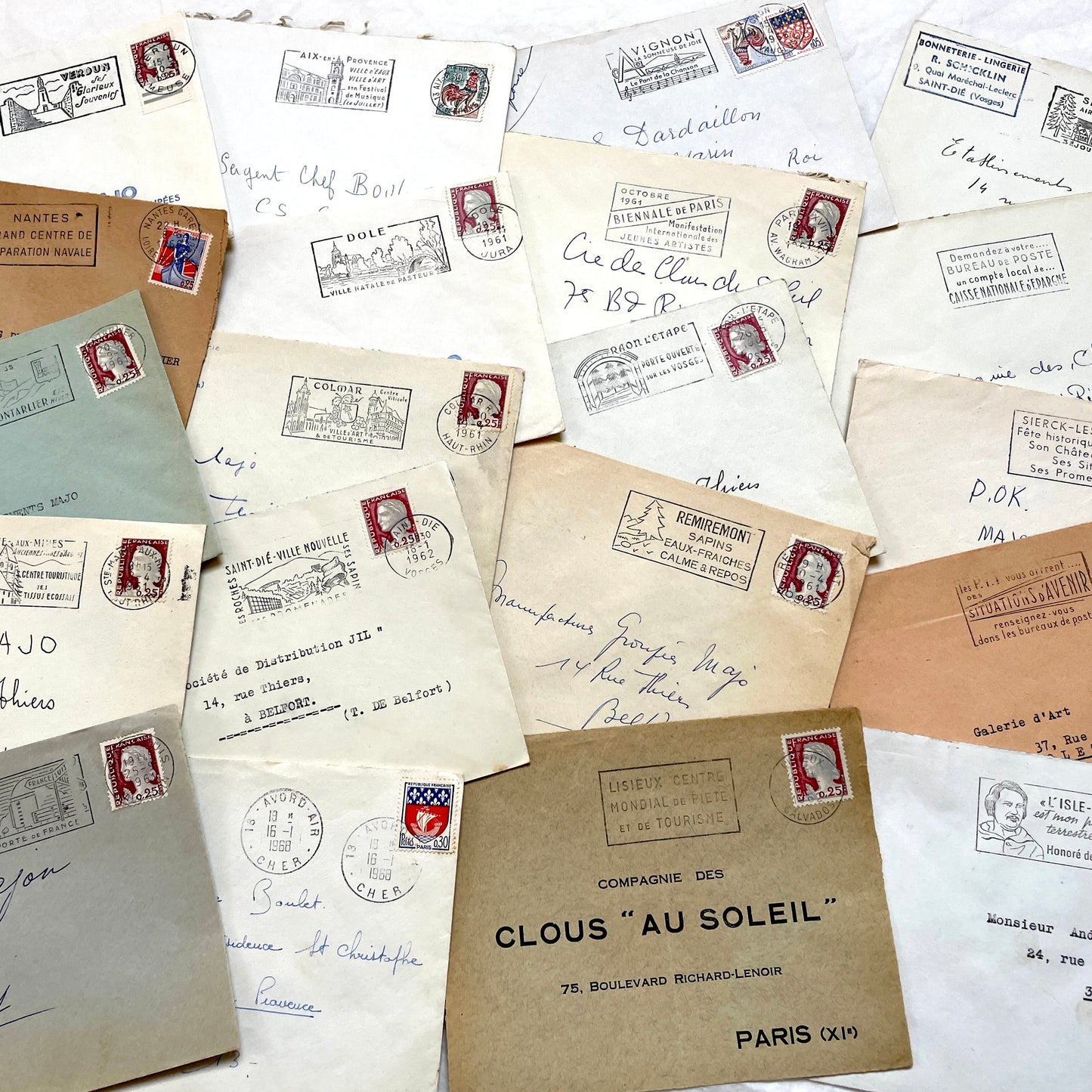 A lot of 20 French envelopes from the 1960s, featuring various postmarks, stamps, and handwritten addresses.
