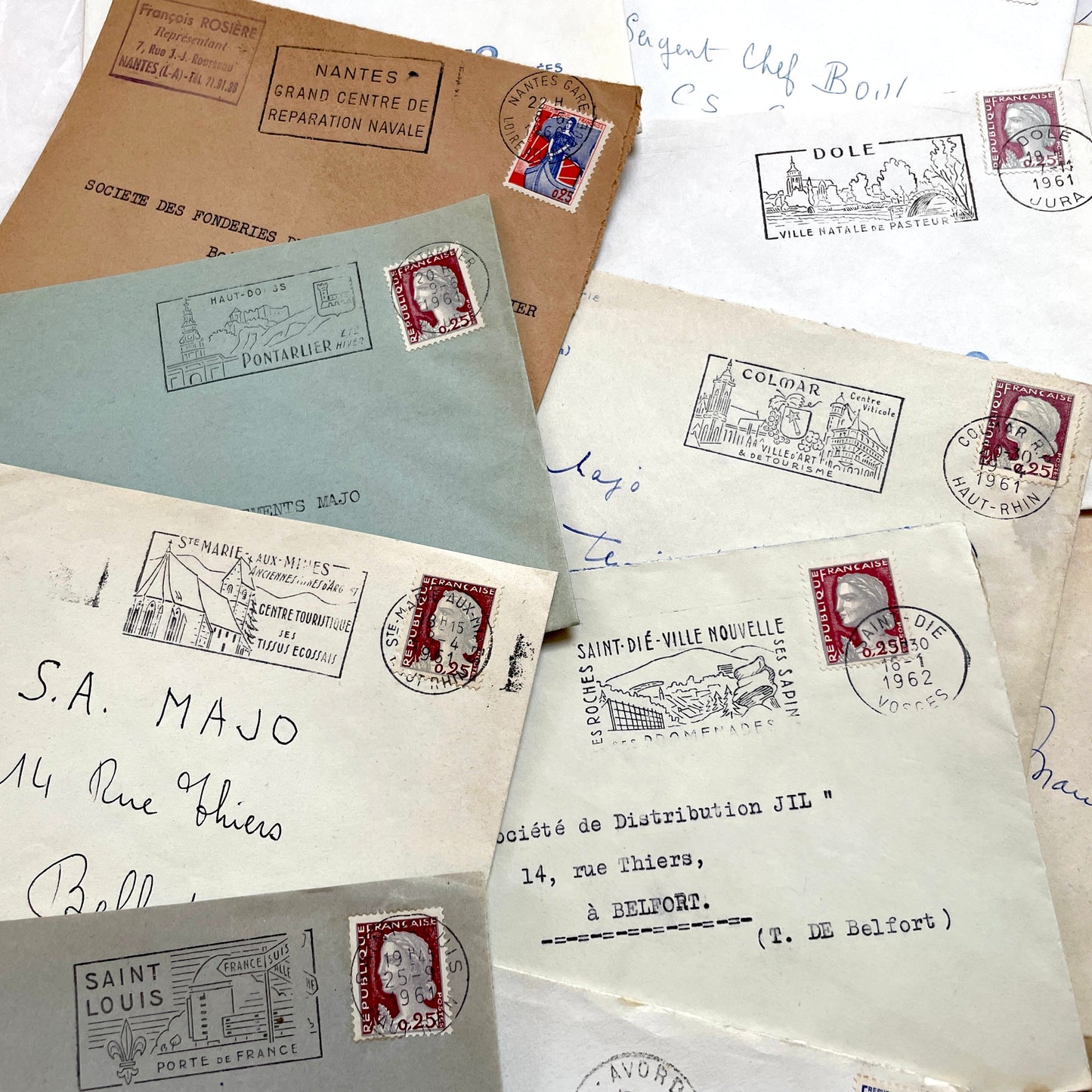 A lot of 20 French envelopes from the 1960s, featuring various postmarks, stamps, and handwritten addresses.