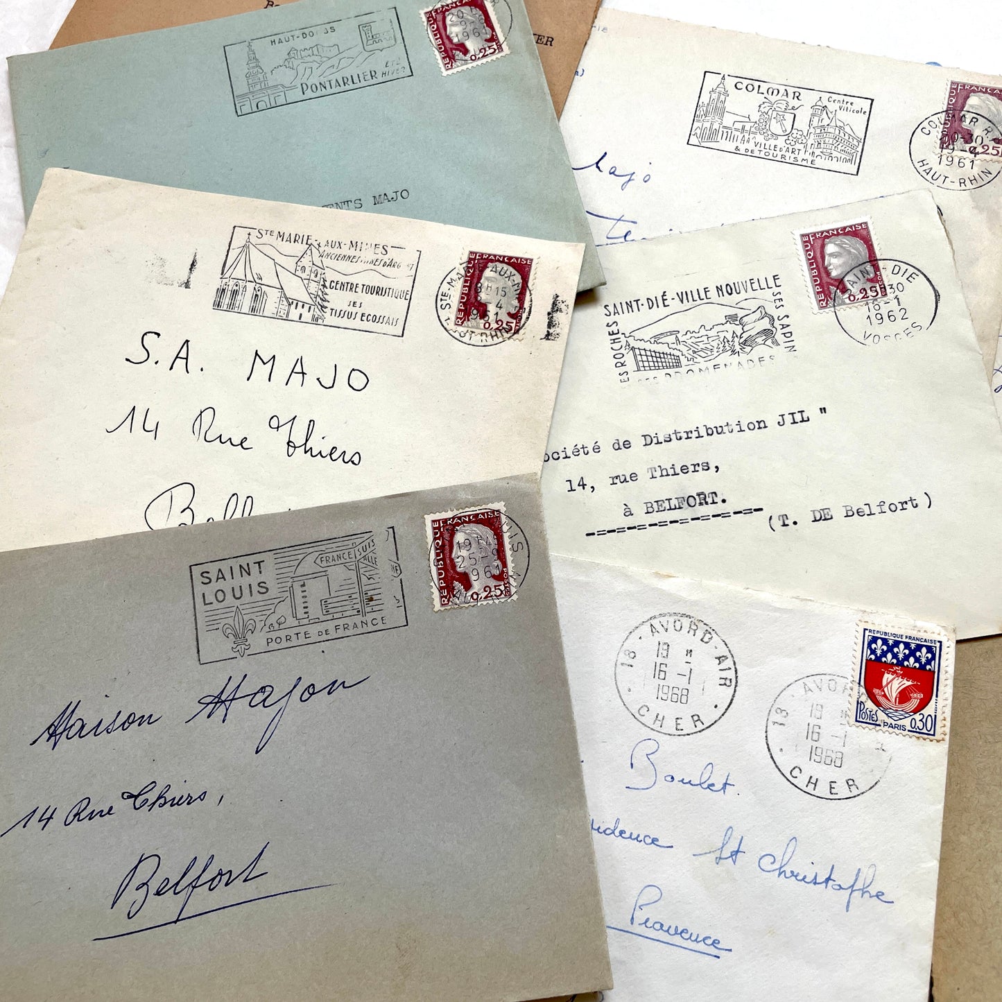 A lot of 20 French envelopes from the 1960s, featuring various postmarks, stamps, and handwritten addresses.