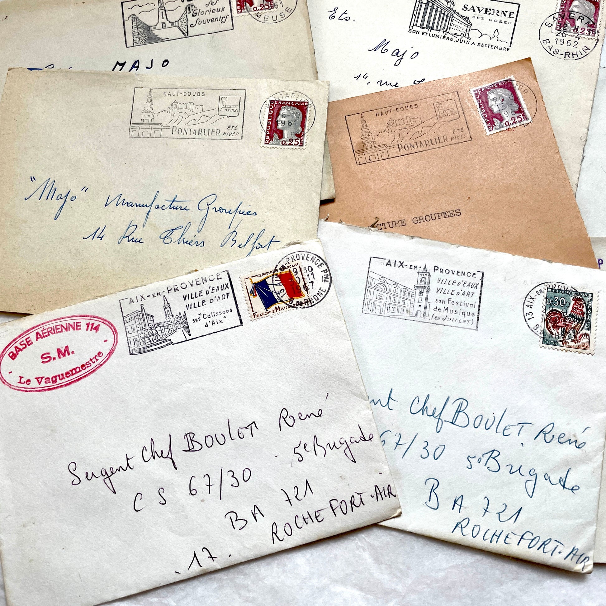 Lot of 20 1960s French envelopes with vintage stamps, diverse postmarks, and handwritten addresses.