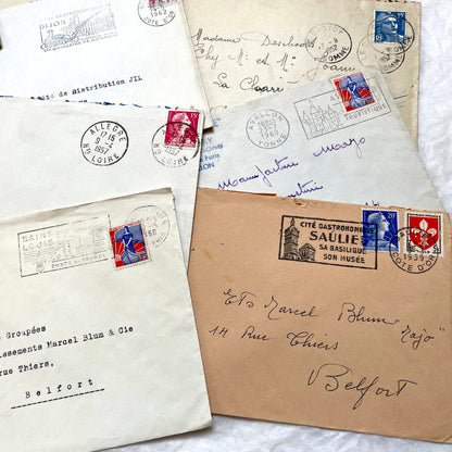 Lot of 20 1960s French envelopes with vintage stamps, diverse postmarks, and handwritten addresses.