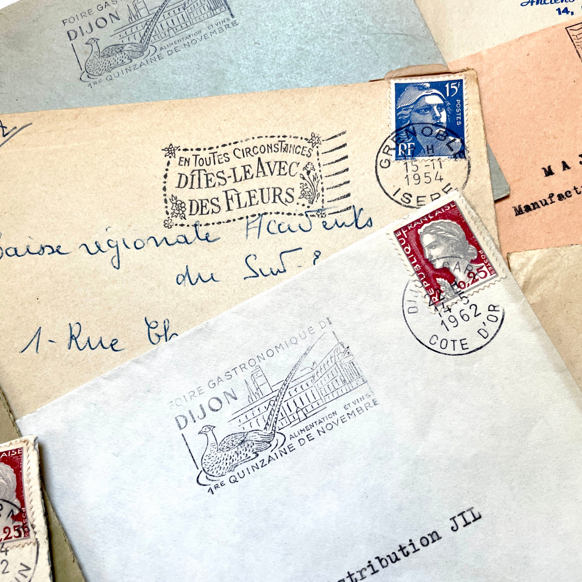 Lot of 20 1960s French envelopes with vintage stamps, diverse postmarks, and handwritten addresses.