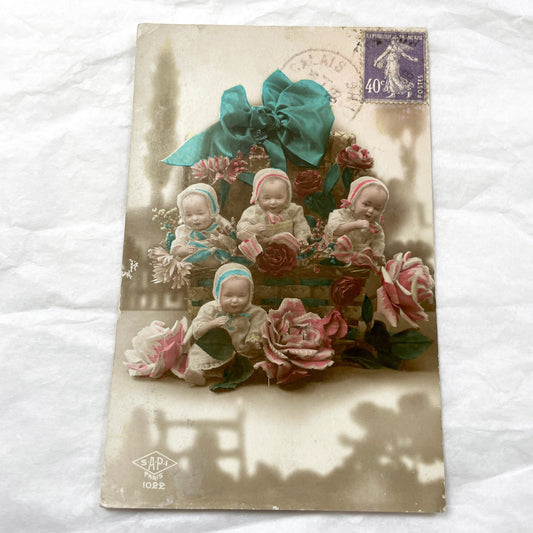 1920s - Vintage French Postcard - Four Charming Baby Dolls - Wicker Basket - Hand-Colored Sepia Tone - Antique Floral Ephemera - Collectible