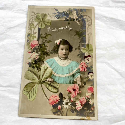 1900s - Antique French Postcard with Child Portrait - Hand-Colored Floral Clover Design - 'Je Vous Aime Bien' - Vintage Collectible Card