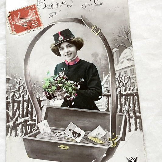 1910s - French Postcard - Hand-Colored New Year Greeting - Young Woman in Hat Holding Flowers - Winter Scene with Letters - Paris Publisher