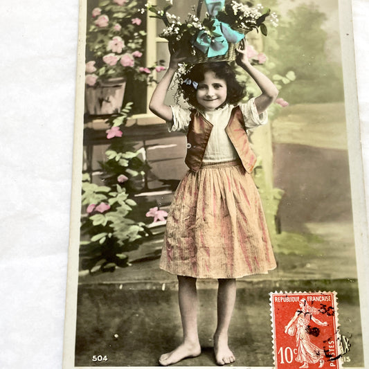 1910s - French May Day Postcard - Charming Hand-Colored Photo - Barefoot Girl with Lily of the Valley Basket - Vintage France Ephemera Art