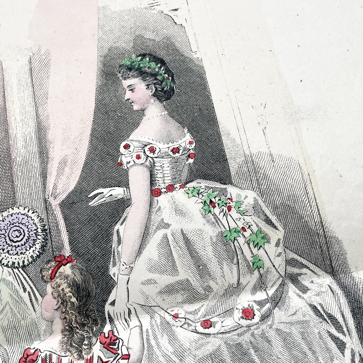 1860s French fashion plate depicting two women in elaborate ball gowns and a child in a red and white striped dress.