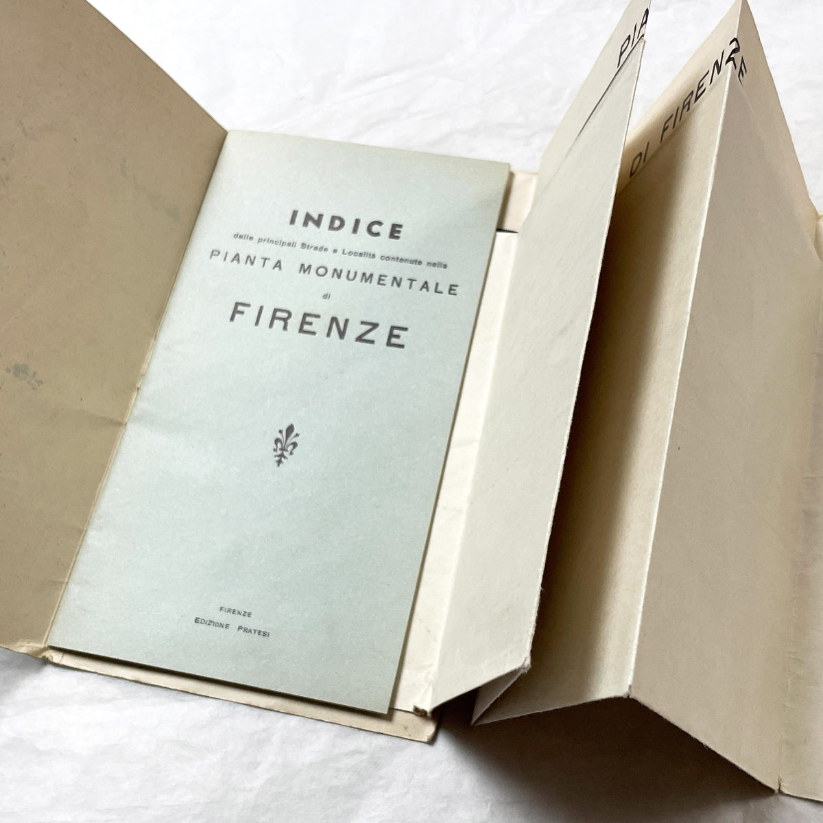 1950s vintage Italian map of Florence with index booklet, showing city plan and the Florentine lily emblem.