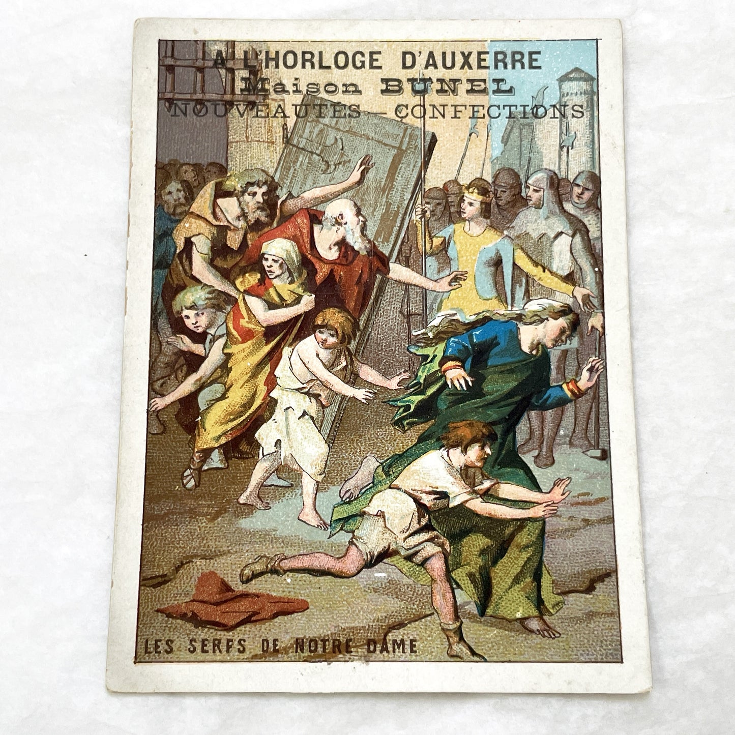 1900s - French Chromolithograph - Notre Dame Serfs Medieval Scene Trade Card - Auxerre Maison Bunel Advertisement