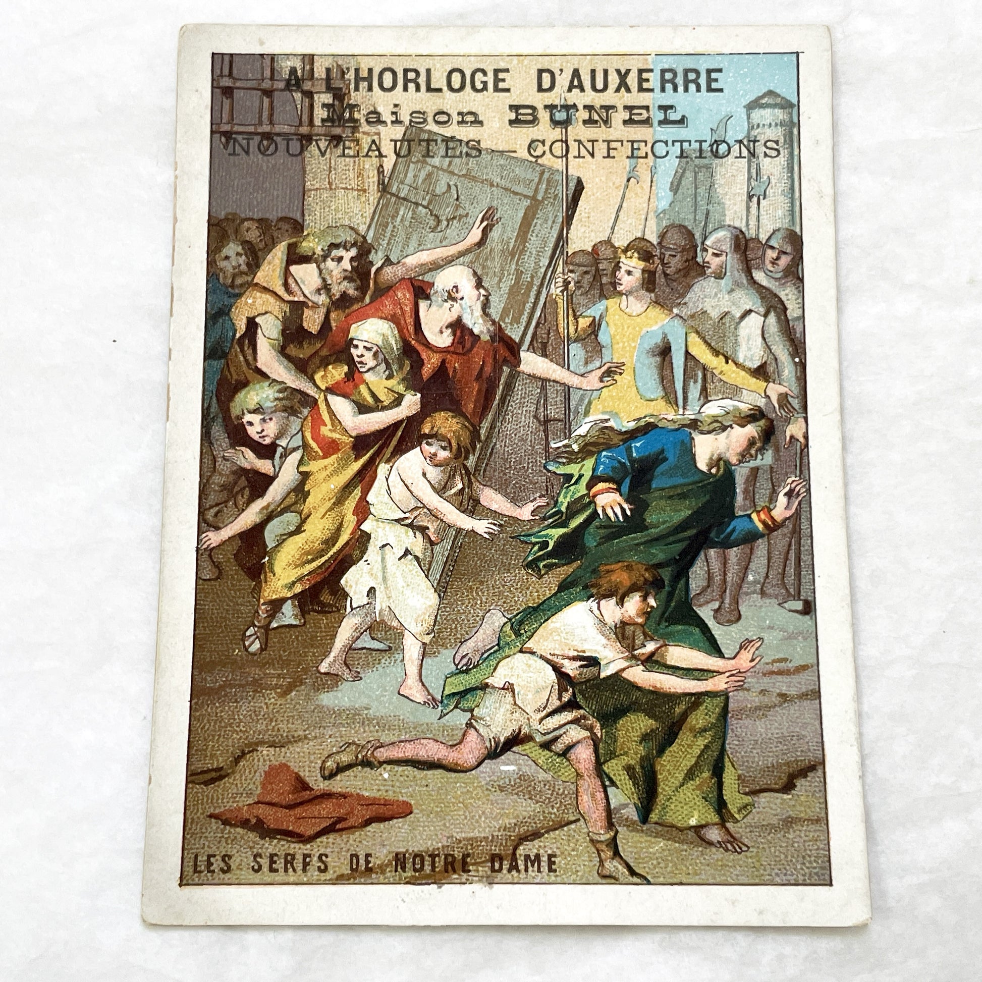 1900s - French Chromolithograph - Notre Dame Serfs Medieval Scene Trade Card - Auxerre Maison Bunel Advertisement