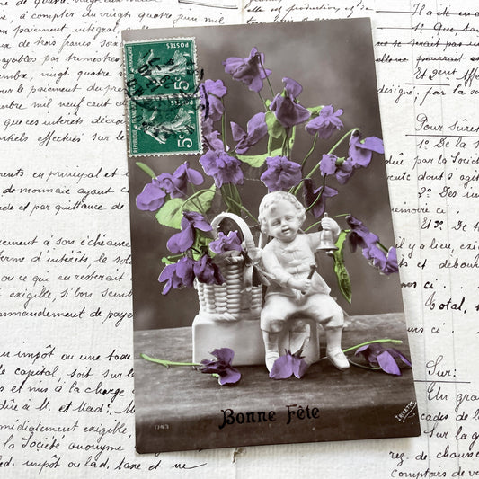 1910s - Antique French Postcard - Cherub Figure with Purple Violets - Sepia Photograph - Bonne Fête Greeting Card - Ephemera Collectible