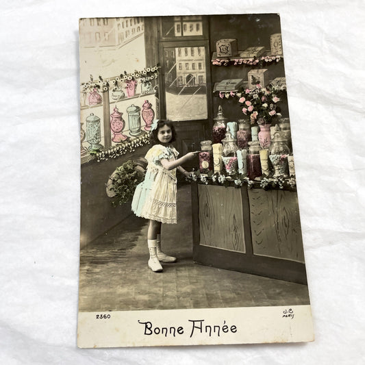 1910s - French Postcard Little Girl Candy Shop Paris Hand-Tinted Sepia Photo - Vintage New Year Greeting Card Ephemera Collectible