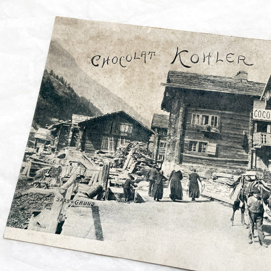 1900s - Vintage Swiss Saas-Grund Village Scene Postcard with Chocolat Kohler Advertising and Alpine Lifestyle - Collectible Ephemera.