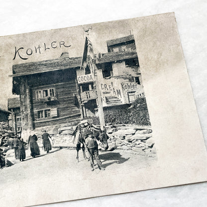 1900s - Vintage Swiss Saas-Grund Village Scene Postcard with Chocolat Kohler Advertising and Alpine Lifestyle - Collectible Ephemera.