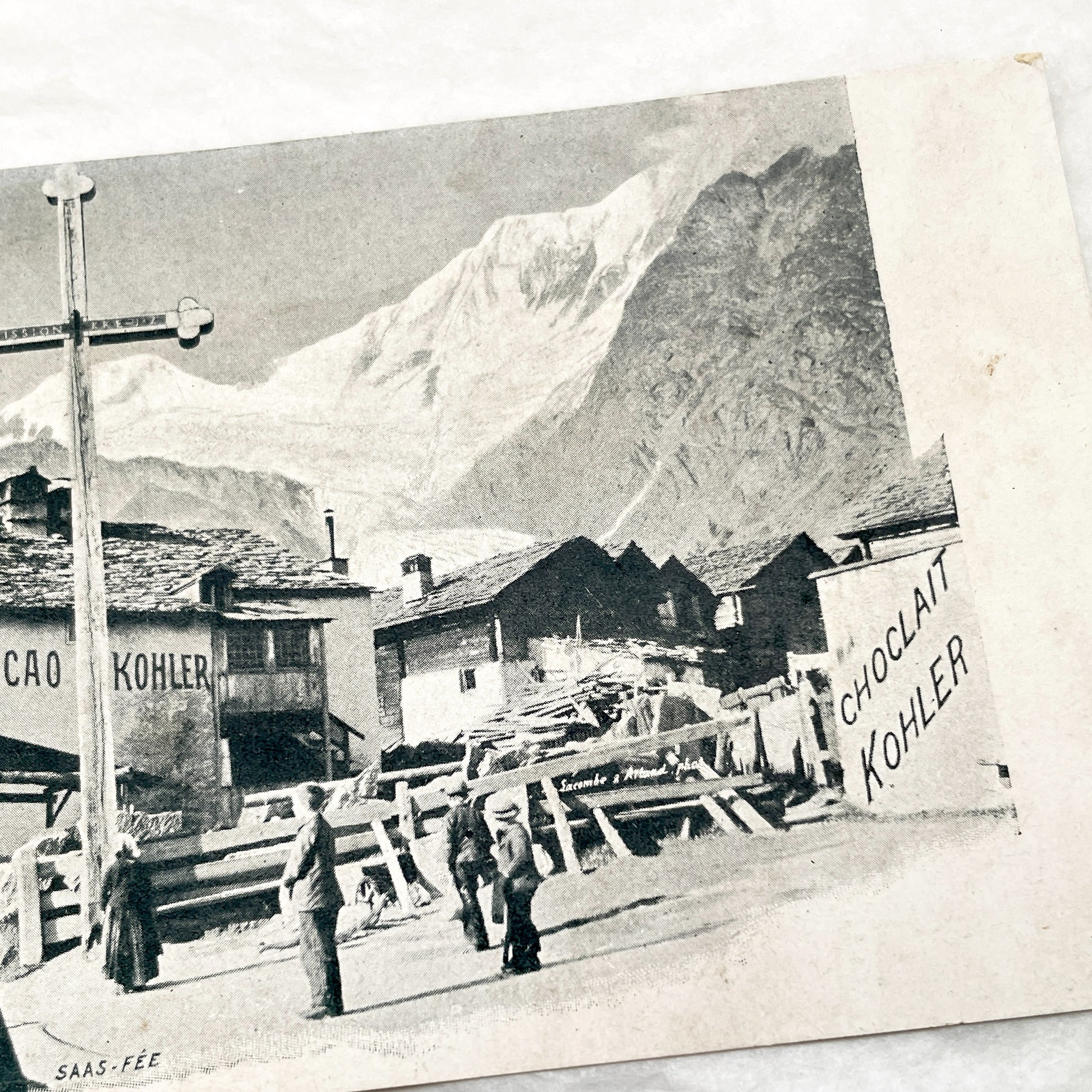 1900s - Vintage Swiss Alps Postcard - Saas-Fee Village Scene with Kohler Chocolate Advertisements - Historic Mountain Landscape