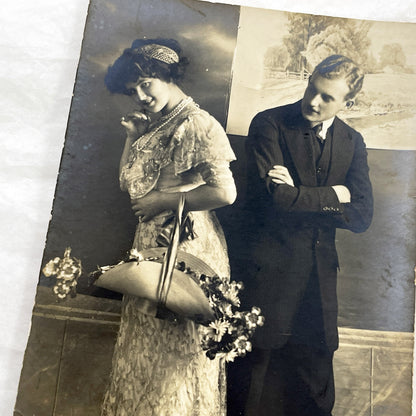 1910s - Vintage Postcard Edwardian Couple - Shy Woman with Flowers Basket - Man with Crossed Arms - Romantic Sepia Photography - Love Scene