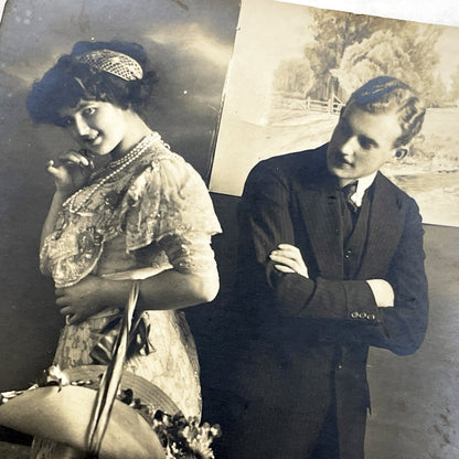 1910s - Vintage Postcard Edwardian Couple - Shy Woman with Flowers Basket - Man with Crossed Arms - Romantic Sepia Photography - Love Scene