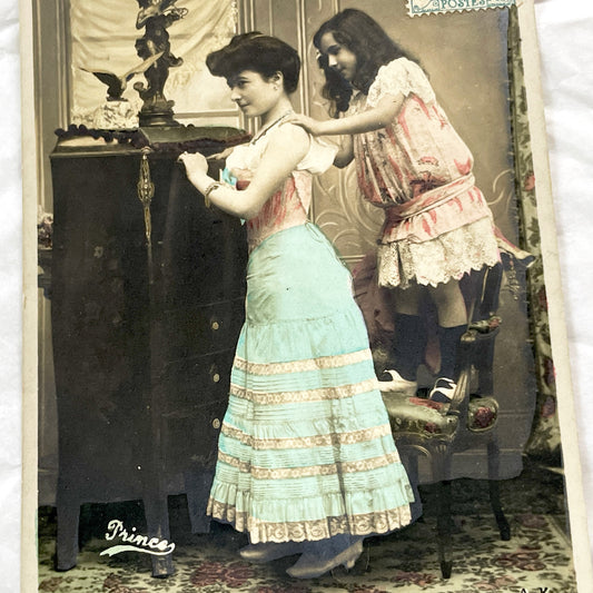 1900s - French Hand Colored Postcard - Young Woman Locking Secret in Discreet Cabinet - Charming Belle Epoque Genre Scene